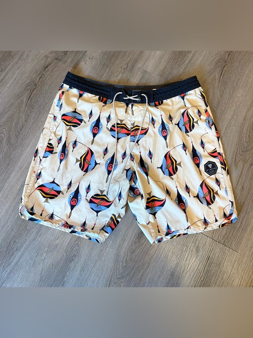 VISSLA Cream Swim Shorts with Navy, Red and Yellow Fish Print